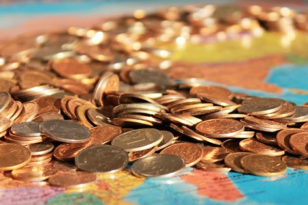 Money Coins on Map Free Stock Photo