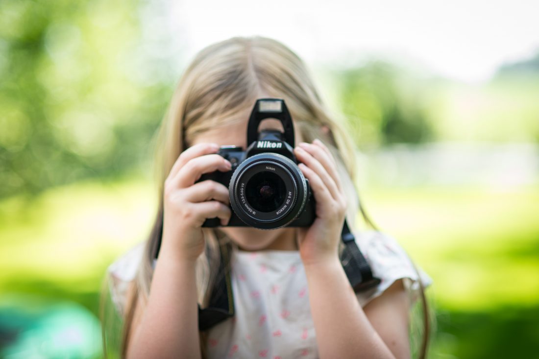 Free photo of Child Using Camera