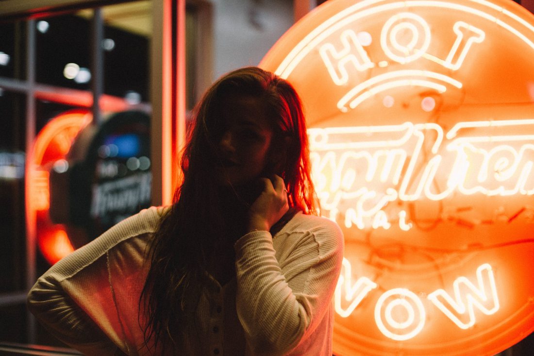 Free photo of Girl by Neon Sign