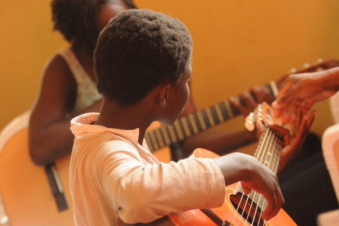 Free photo of Africans Playing Guitar