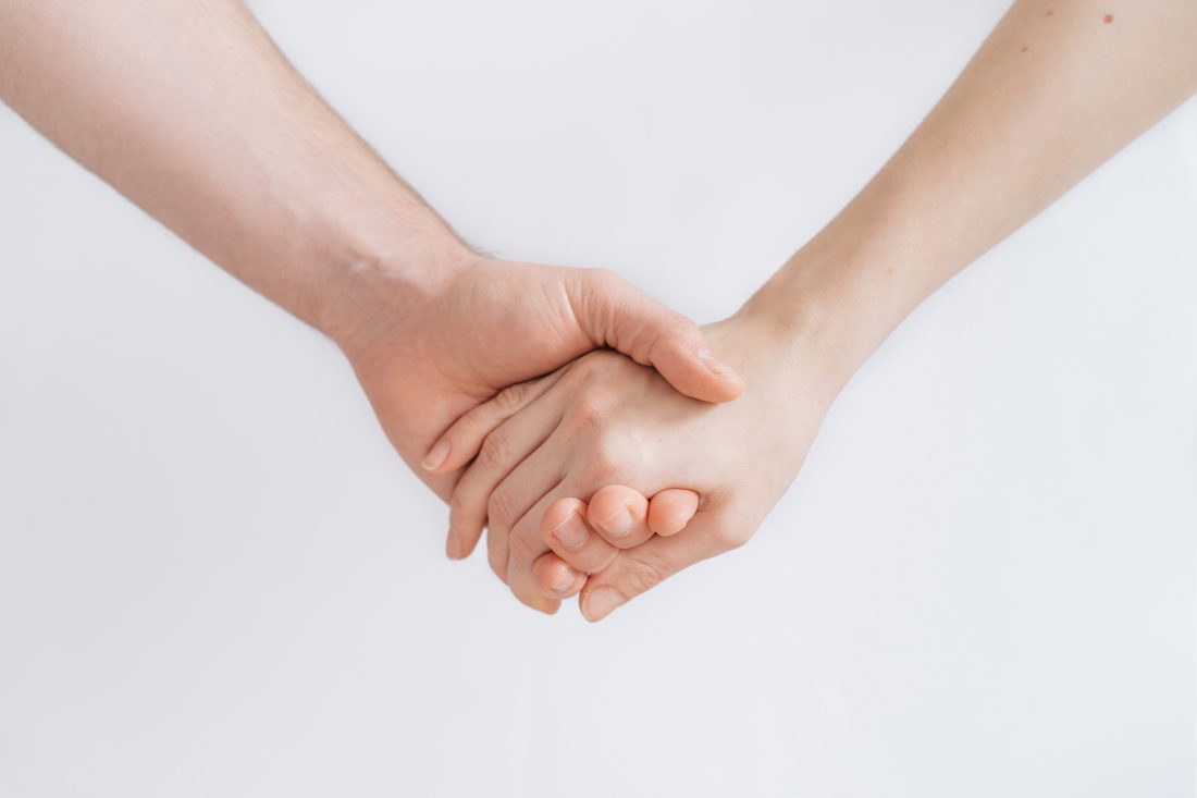 Free photo of Couple Holding Hands