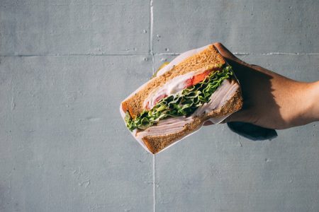 Hand Holding Bread Sandwich