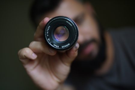 Photographer Holding Lens