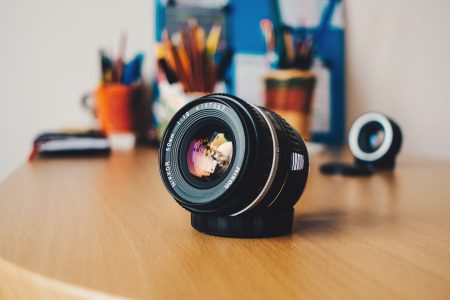 Camera Lens on Desk Free Stock Photo
