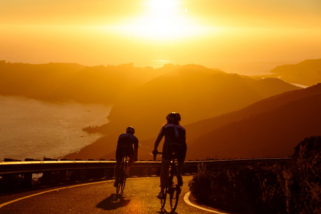 Free photo of Men Cycling at Sunset