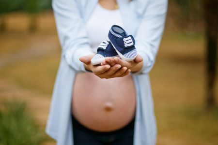 Pregnant Woman & Shoe Free Stock Photo