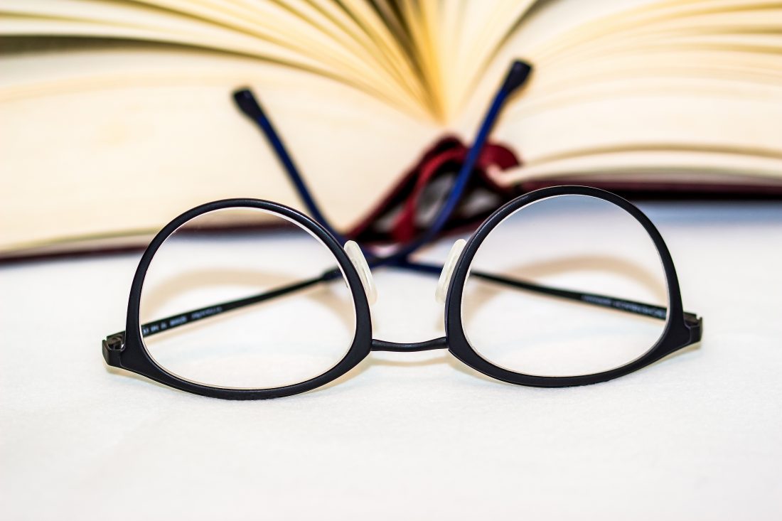Free photo of Reading Glasses & Book