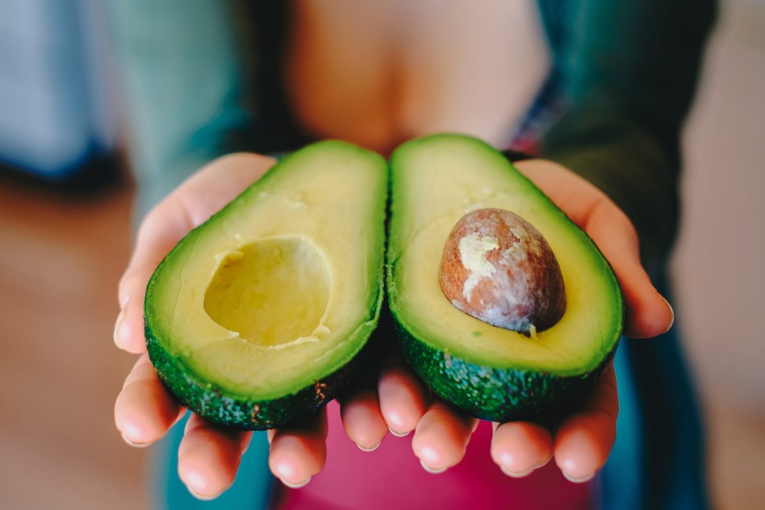 Free photo of Woman Holding Avocados