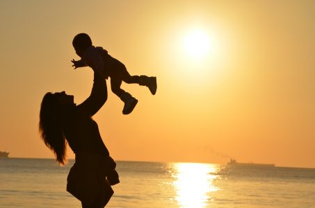 Baby & Mother at Beach Free Stock Photo