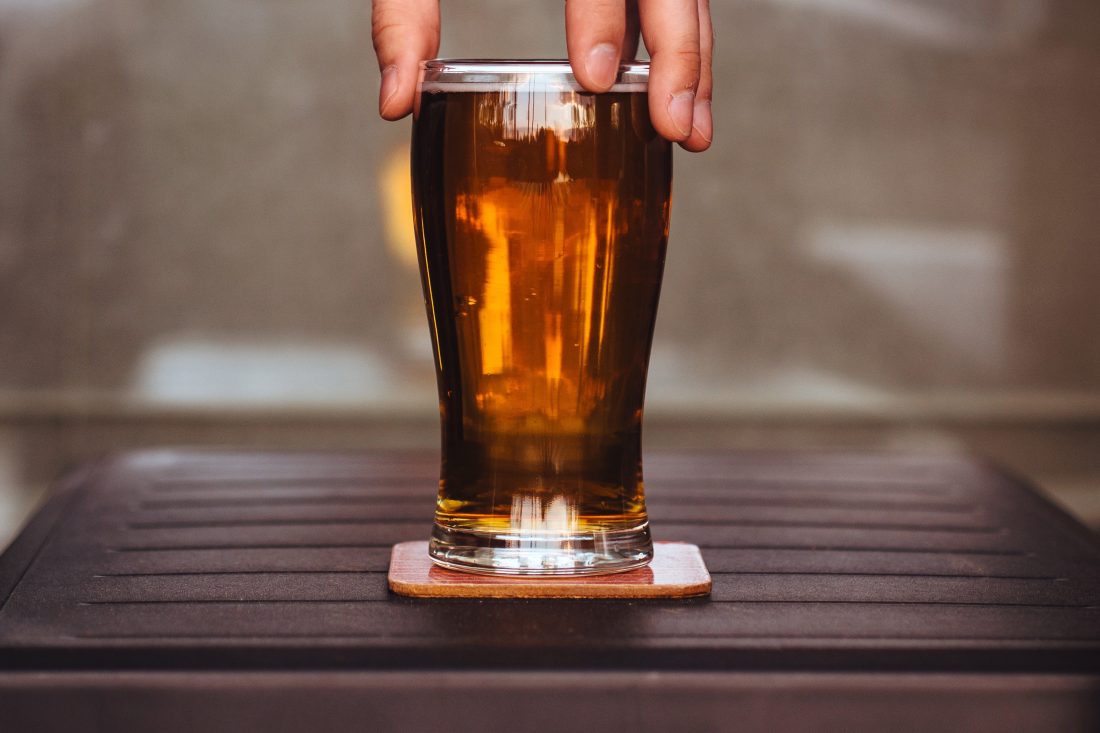 Free photo of Man Holding Beer Glass