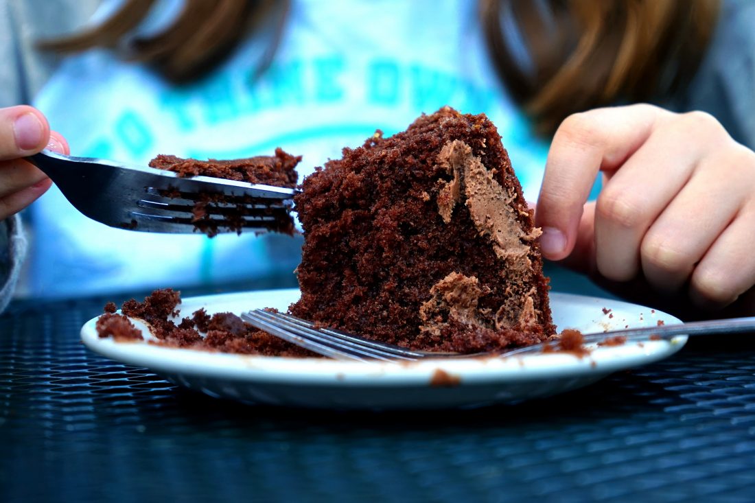 Free photo of Person Eating Cake