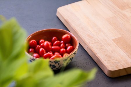 Tomatoes on Chopping Board Free Stock Photo
