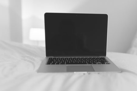 Laptop on Bed Free Stock Photo