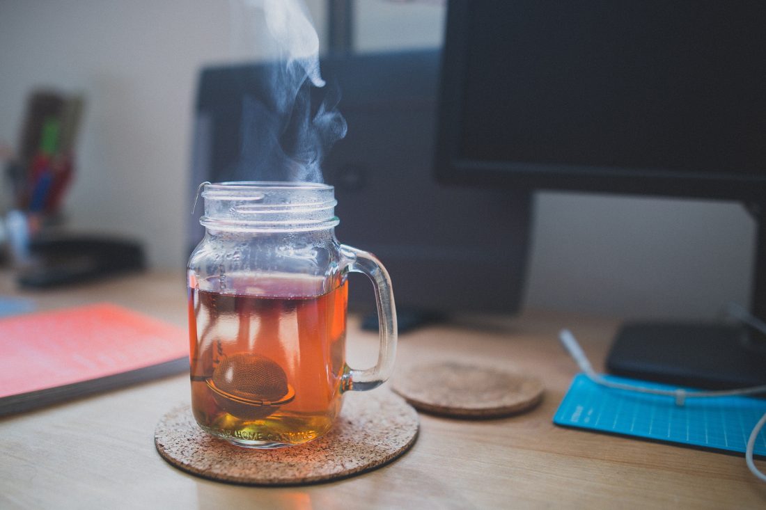 Free photo of Hot Tea Jar & Computer Desk