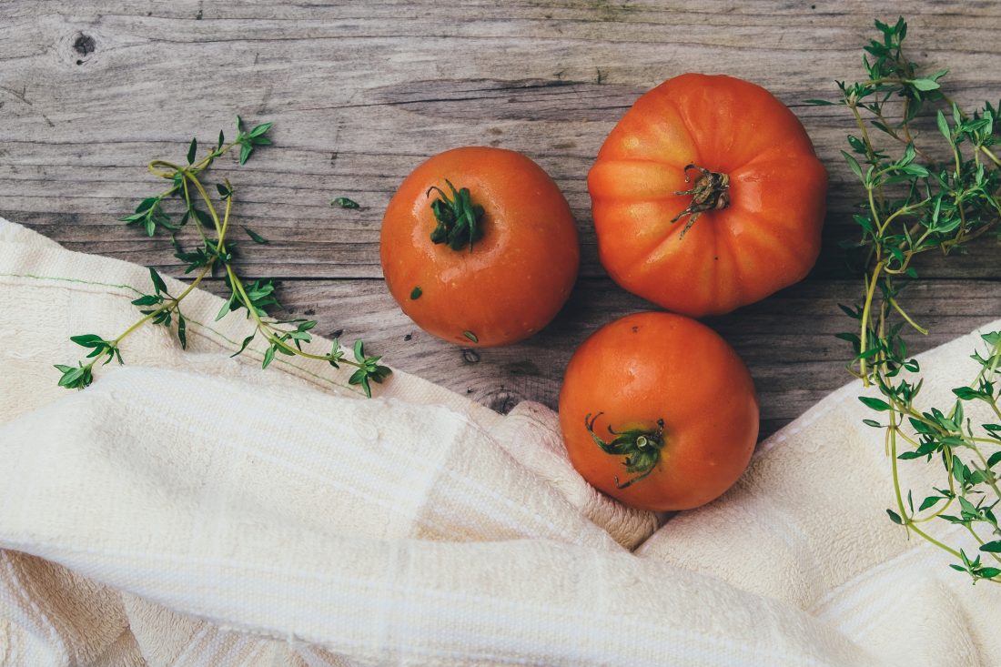 Free photo of Tomatoes on Wood Table