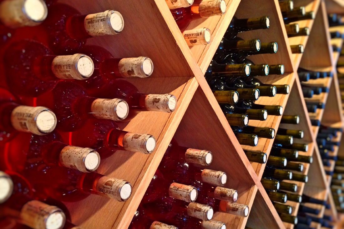 Free photo of Wine Bottles on Rack