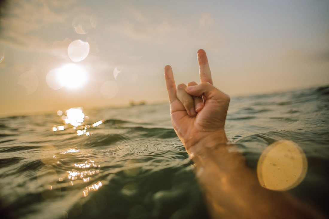 Free photo of Surfer Hand in Ocean
