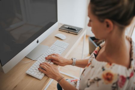 Woman on Computer Typing Free Stock Photo