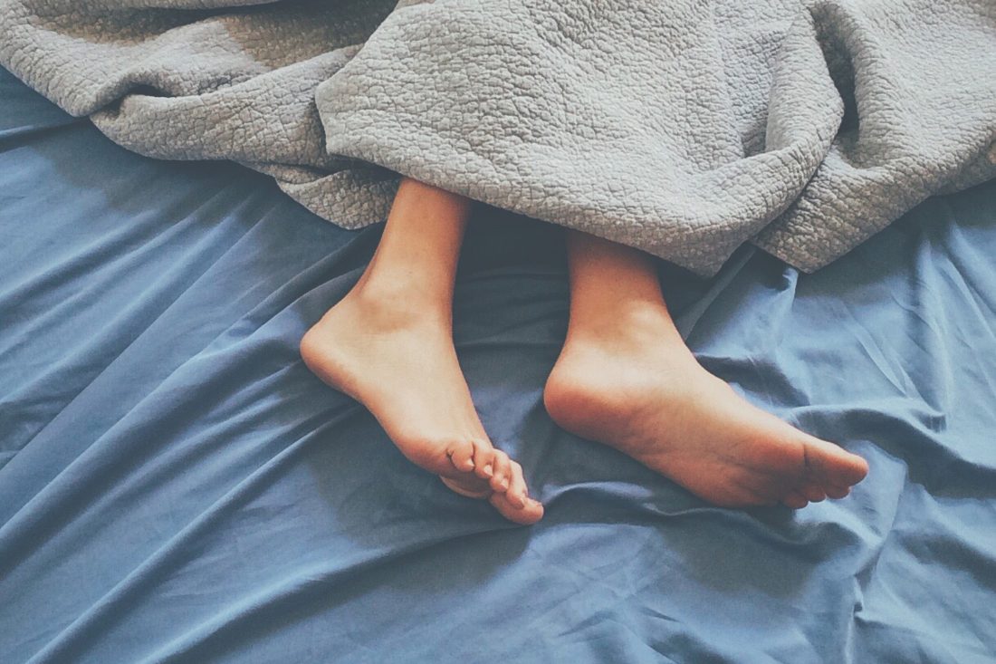Free photo of Sleeping Feet in Bed
