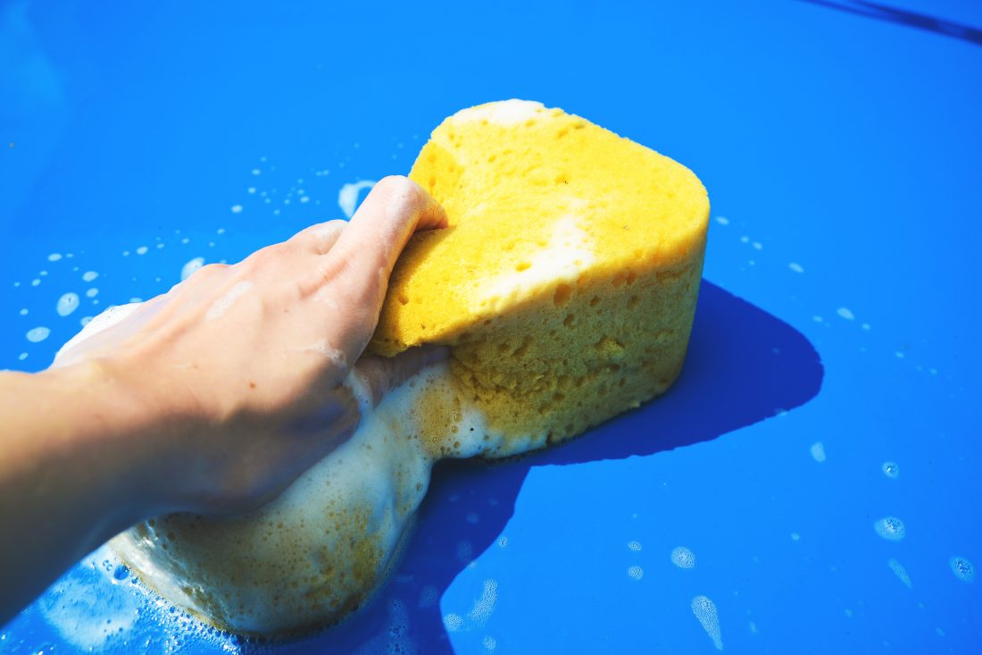 Free photo of Washing Car with Sponge