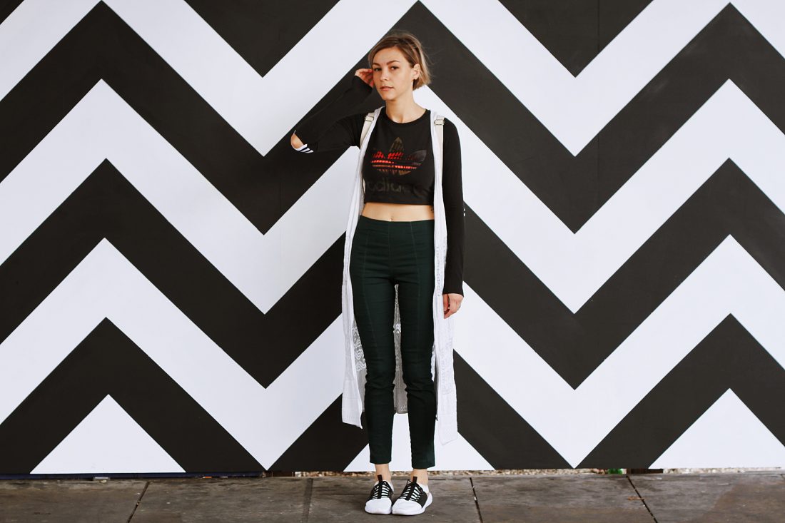 Free photo of Woman by Patterned Wall