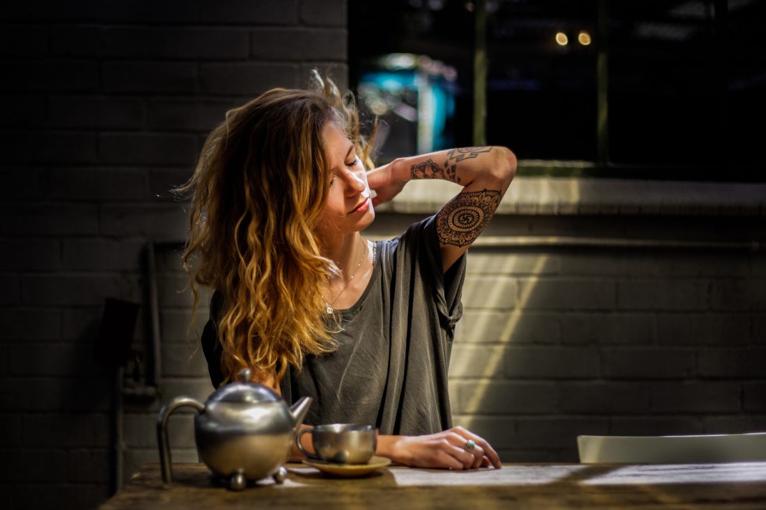 Free photo of Woman With Tattoo & Long Hair