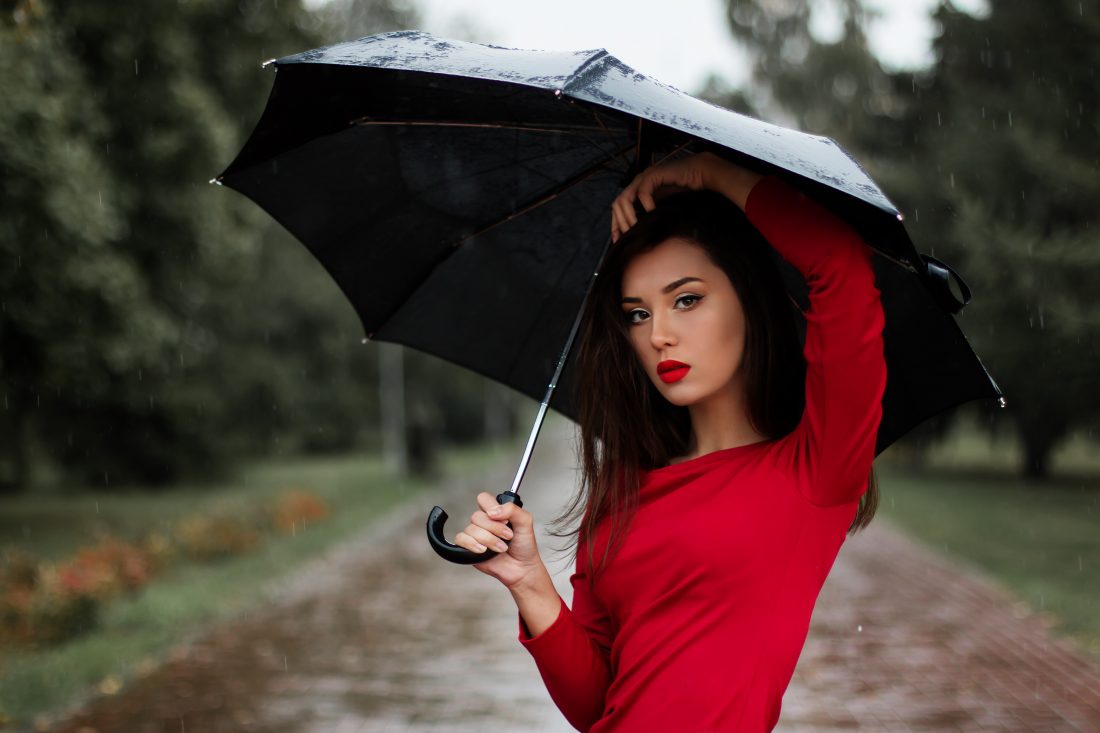 Free photo of Woman Holding Umbrella
