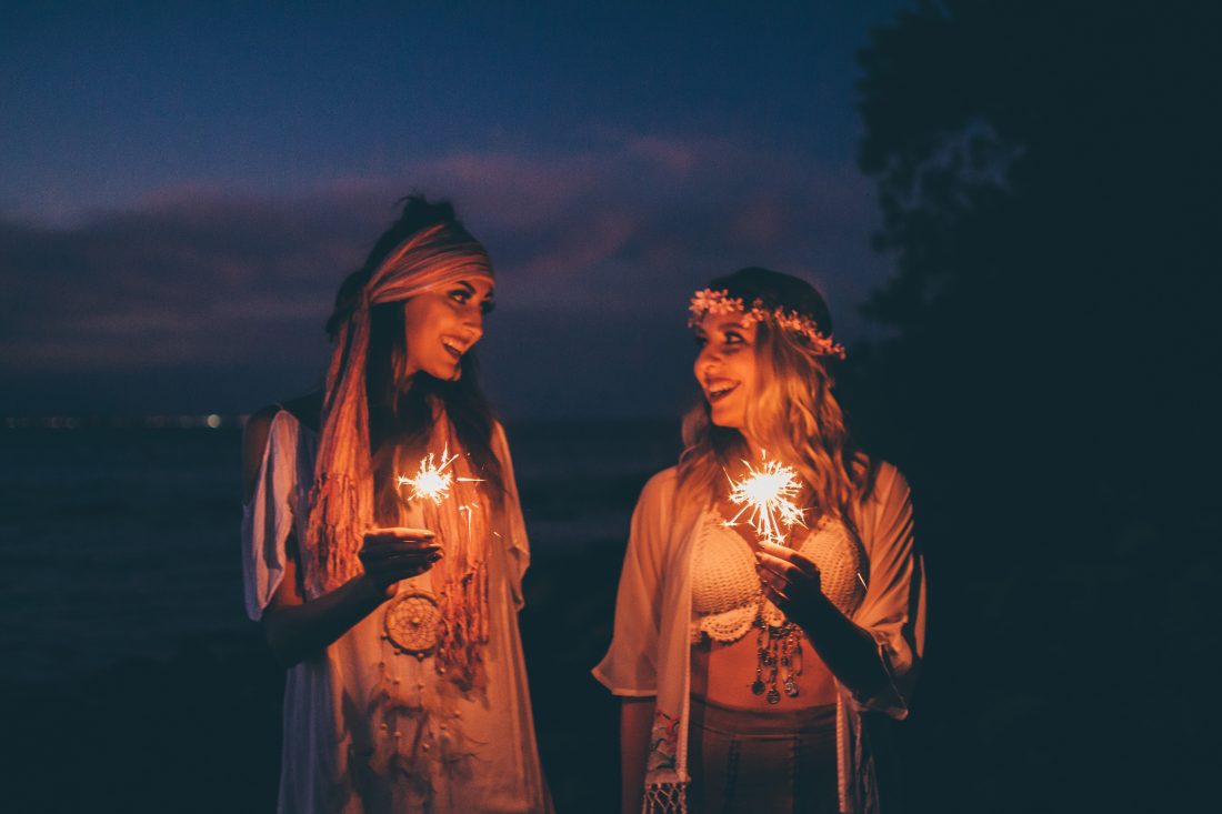 Free photo of Women Holding Sparklers Evening