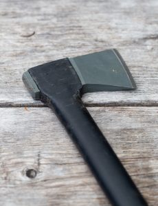 Axe on Wooden Table Free Stock Photo