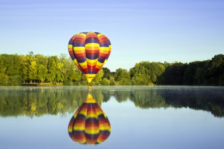 Hot Air Balloon Over Lake Free Stock Photo