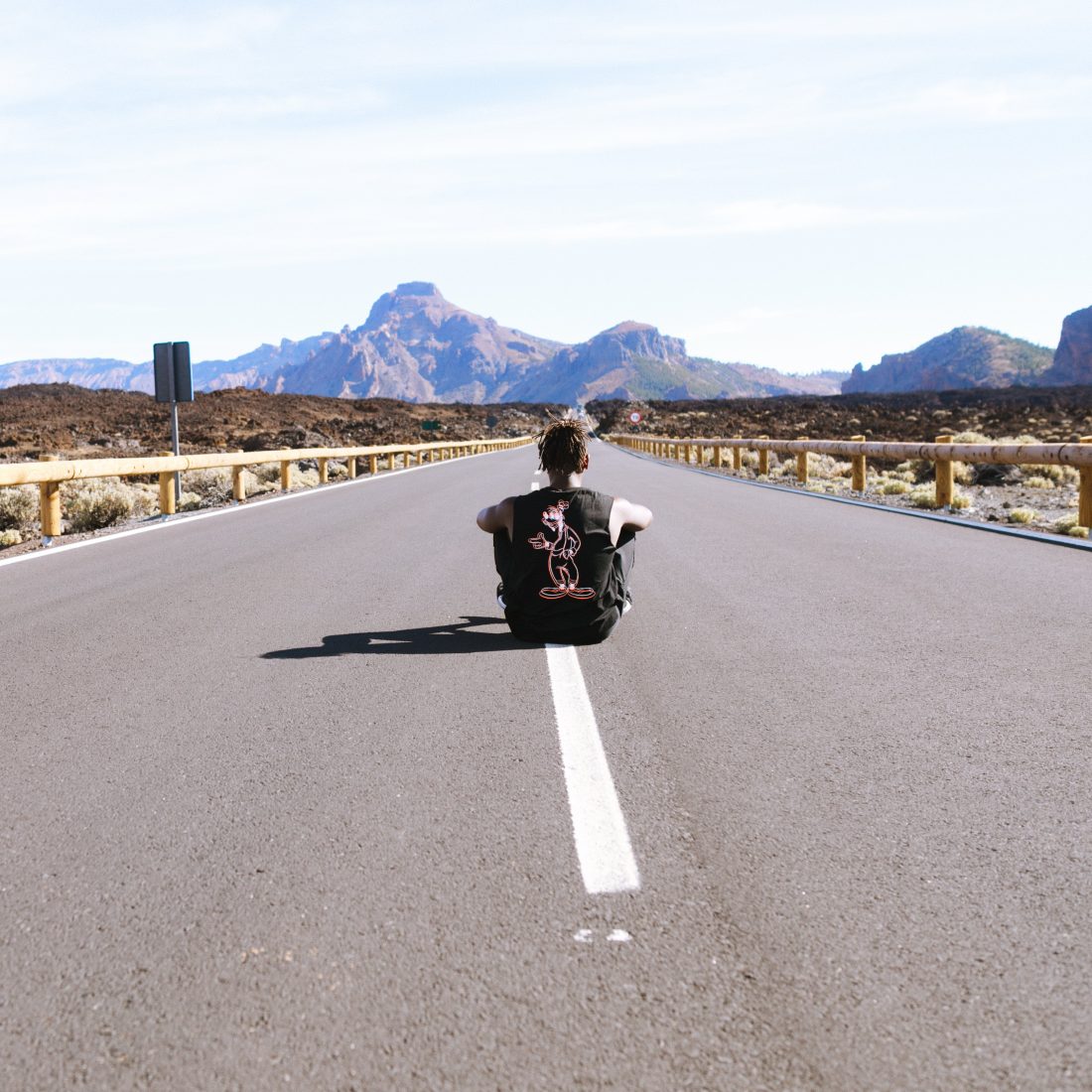 Free photo of Man in Road and Mountains