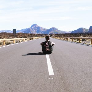 Man in Road and Mountains Free Stock Photo