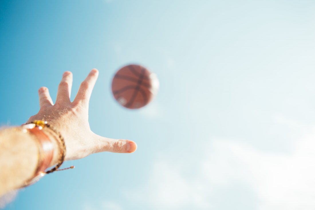 Free photo of Basketball and Hand in Sky