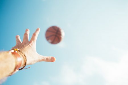Basketball and Hand in Sky Free Stock Photo